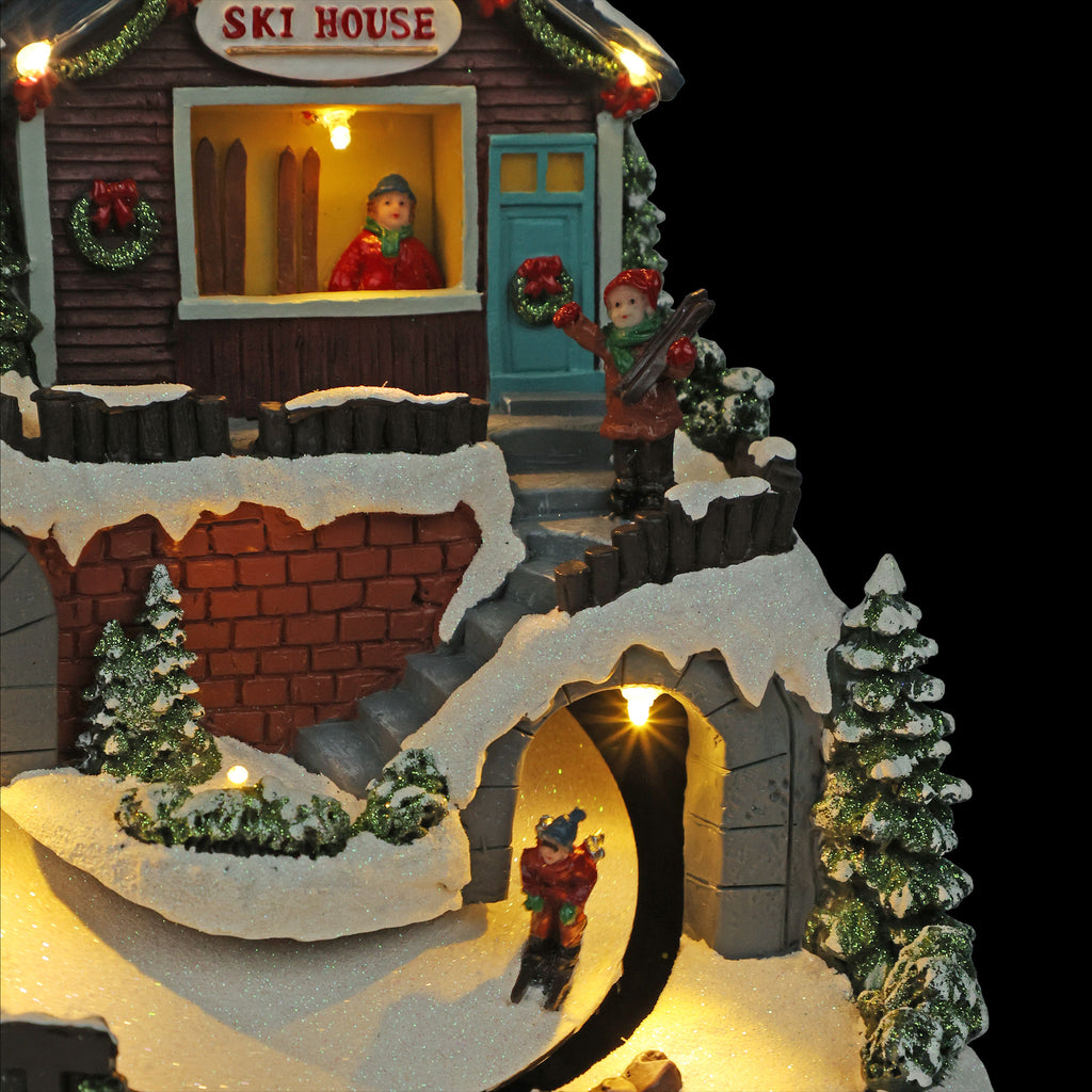 Alpine Corporation Animated Children Playing in Christmas Village Holiday Tabletop Decor with 26 Multicolor LED Lights and 5.9' Cord, 17" L x 11" W x 9" H