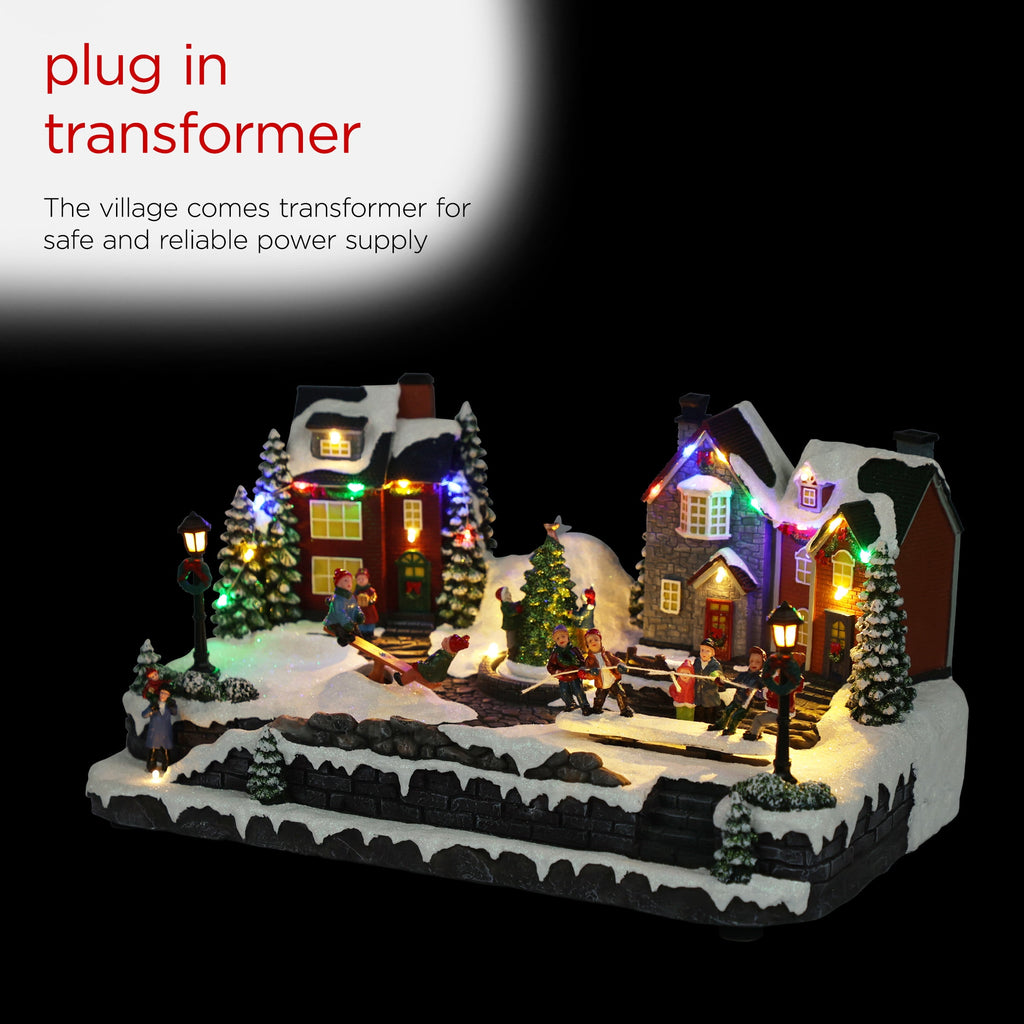 Alpine Corporation Animated Children Playing in Christmas Village Holiday Tabletop Decor with 26 Multicolor LED Lights and 5.9' Cord, 17" L x 11" W x 9" H
