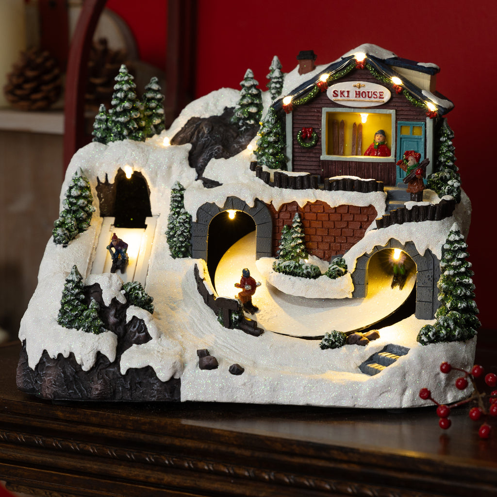 Alpine Corporation Animated Children Playing in Christmas Village Holiday Tabletop Decor with 26 Multicolor LED Lights and 5.9' Cord, 17" L x 11" W x 9" H